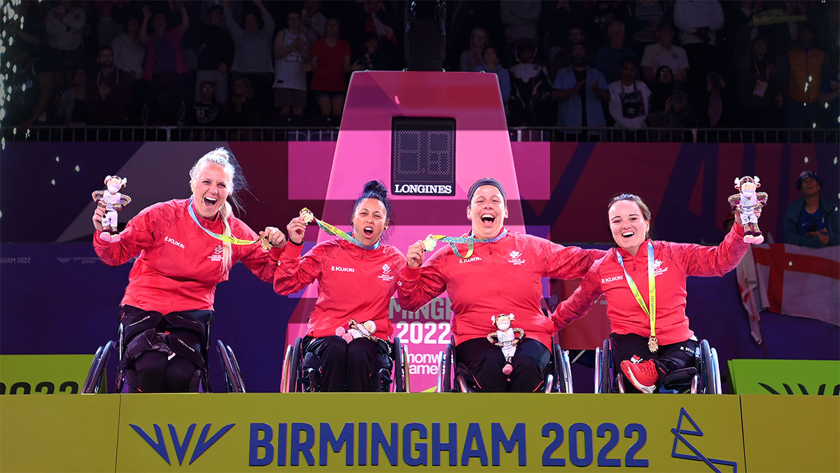 Commonwealth Games team holding gold medals
